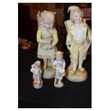 4 Porcelain figurines - large female has crack on