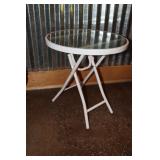 Glass and metal outdoor folding bistro table