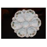 Oyster plate decorated with flowers and gold trim