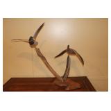 Carving of flying mallard drake and hen mounted