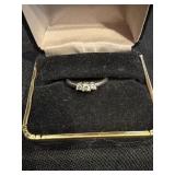 Ring with 3 small clear stones marked 14K