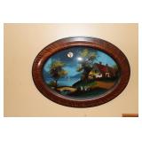 Reverse painting with a house and bridge on the