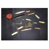 Lot of miniature pocket knives and a Winchester