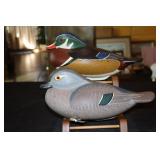 Pair of full size tucked head wood duck decoys by