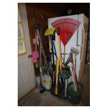 Garden tool lot with organizer including shovels,