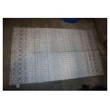 Gray and white accent rug 59" x 35"