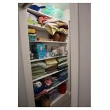 Contents of laundry room inculding towels, light