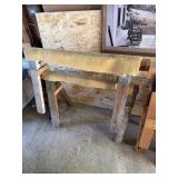 Pair of saw horses with carpet top