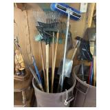 Plastic trash can with lid, rakes, shovel, broom,