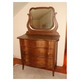 Oak serpentine front dresser with 4 drawers and