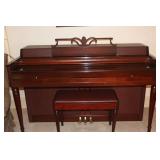 Wurlitzer upright piano with walnut finish with