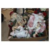 4 shelf sitting Santa Claus figures