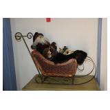 Santa Claus figurine in a wicker & metal sleigh