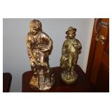Pair of gold colored statues (one marked