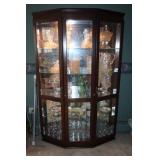 Mahogany colored double door curio cabinet