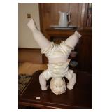 Resin boy standing on hands statue