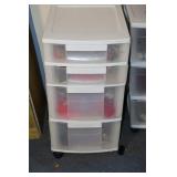Plastic 4 drawer storage unit with contents -