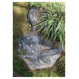 Cement bust of a woman