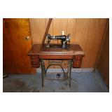 Singer sewing machine with treadle base (located