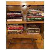 Assortment of cookbooks in cabinet - To Market