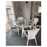 Wicker style patio set with glasstop table,