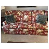 Red floral decorated 3 cushion sofa