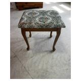 Footstool with upholstered top