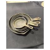 5 Various size cast iron fry pans - 3 marked