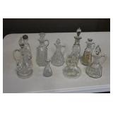 Lot - 8 glass cruets and 1 shacker