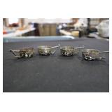 4 Demitasse cup holders with hallmarks (possibly