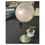 Shaving stand with tilting mirror, brushes and