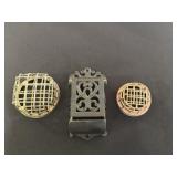 Cast iron match holder and 2 floral frogs