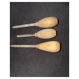 3 Wooden handle oyster knives marked Briddell