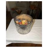 Bail handled tin containing wooden blocks