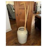 Stoneware crock containing a walking stick