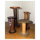 4 Wooden textile bobbins or spools