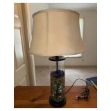 Glass table lamp filled with marbles