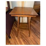 Oak two tiered parlor table with bobbin style legs