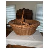 Wicker picnic or gathering basket containing
