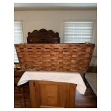 Large woven wooden laundry style basket with