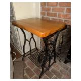 Wooden table made from an antique cast iron