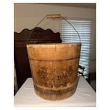 Local advertising - antique wooden bucket with