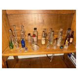 Shelf lot of collectible perfume bottles,