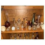Shelf lot of collectible perfume bottles,