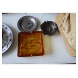 3 ashtrays - 1 amber glass with gun design, 2
