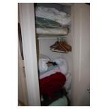 Contents of closet including blankets, linens,