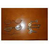 Lot - 2 eyeglasses, clock key, and 3 skeleton