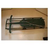 Green painted metal and wood sled