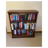 Pine bookcase with assorted books by