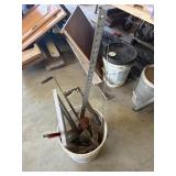 Bucket including masonry tools, antique brick